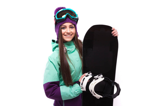 pretty woman in ski suit hold snowboard - Photo, Image