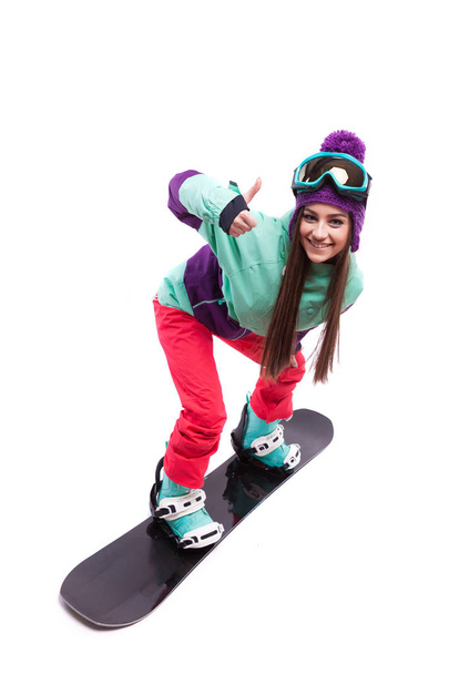 young woman riding snowboard - 写真・画像