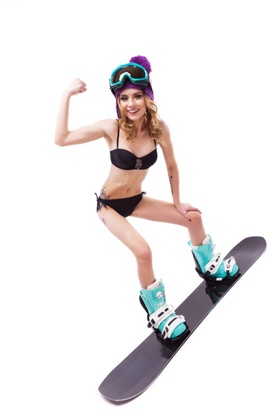 Winter sport, snowboarding- girl in a bathing suit  - Фото, изображение