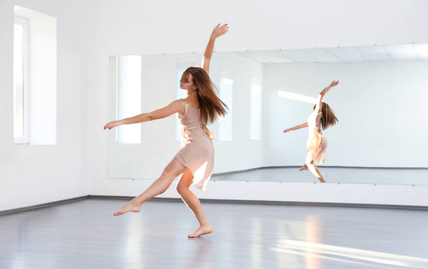Beautiful young woman dancing in studio - Foto, Imagem