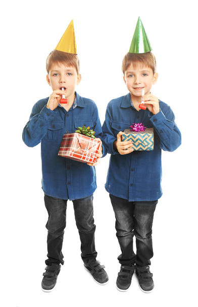 birthday boys with party whistles and presents - Zdjęcie, obraz