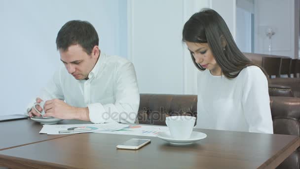 Two business partners finishing their coffee and getting ready to work - Felvétel, videó