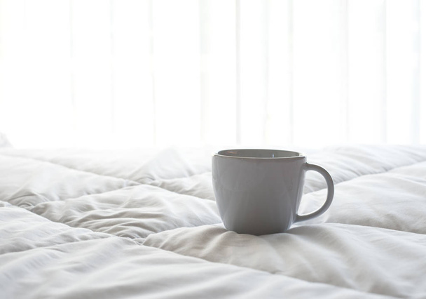 Fresh morning coffee on the bed. - Фото, зображення