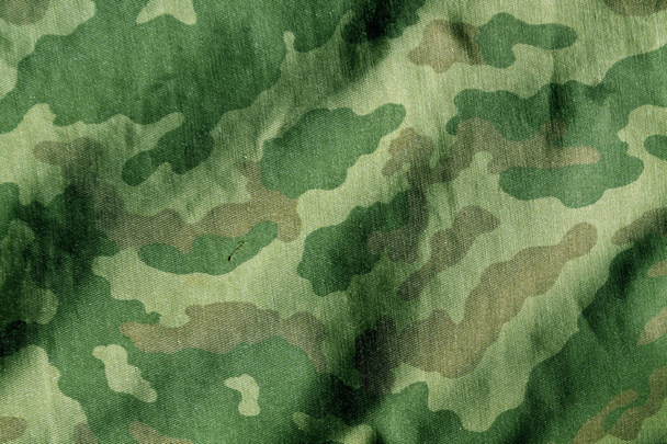 Weathered camouflage cloth texture. - Photo, Image