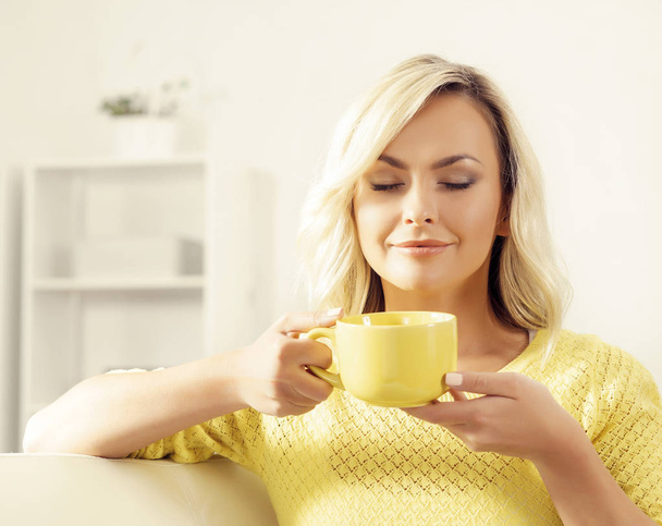 young woman with cup of coffee - Φωτογραφία, εικόνα