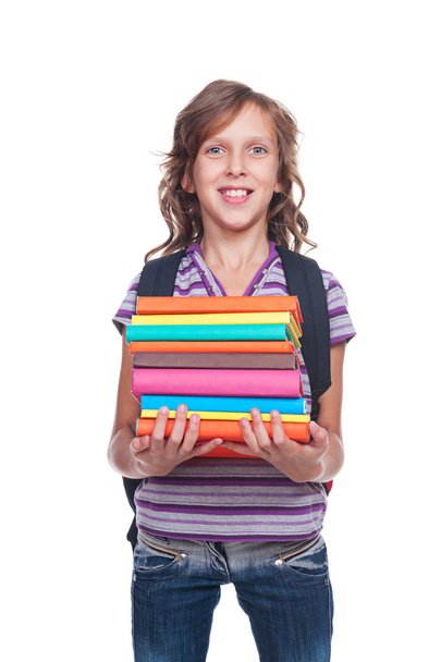 smiley little student holding some books - Photo, Image