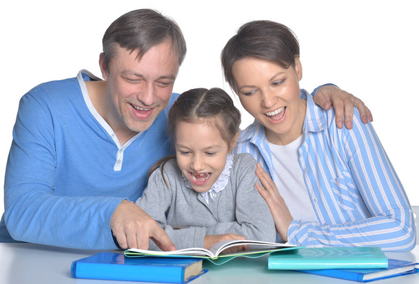 parents with daughter reading books - Foto, Imagen