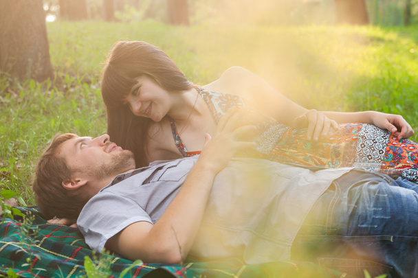 Young couple on a romantic picnic outdoors - 写真・画像