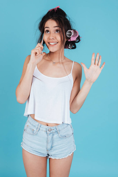 Attractive young lady talking by phone - Foto, afbeelding