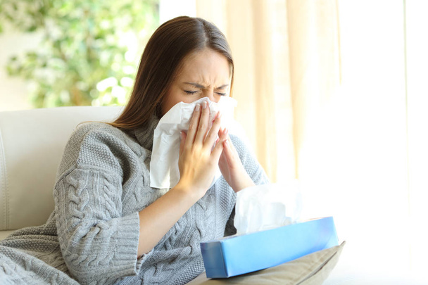 Woman blowing with flu in winter - Photo, Image