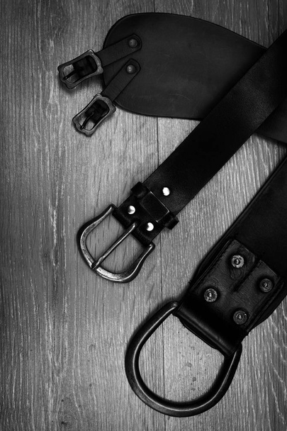 leather belts in black and white  - Zdjęcie, obraz