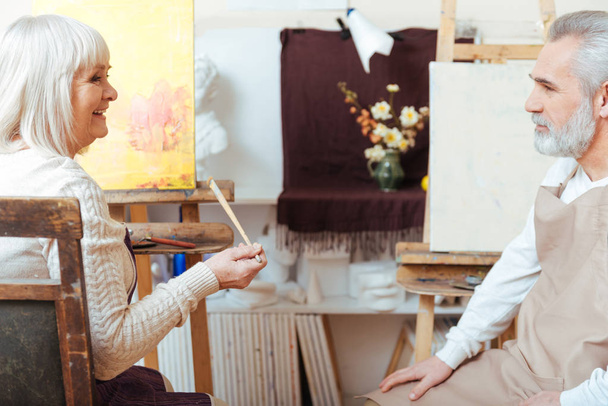 Male and female artists sitting in painting class together - Photo, image