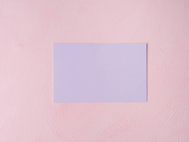 Purple pastel card on pink textured background - Photo, Image