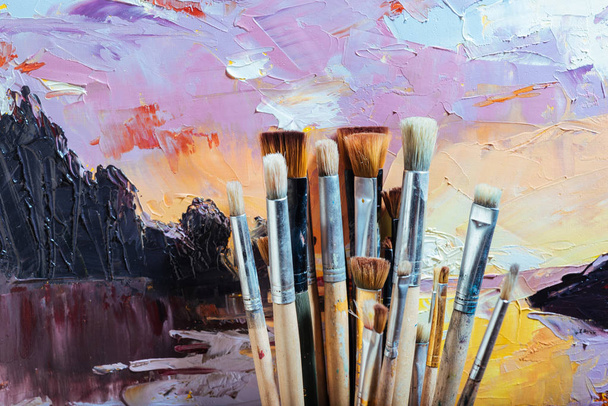 Close up of bright painting and brushes - Photo, Image