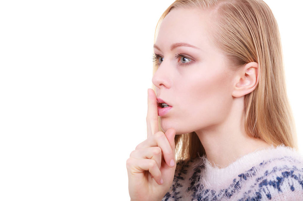 Young blonde woman making silence gesture - Foto, imagen