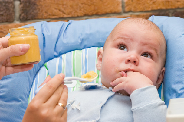 Baby boy while mother feeding - Fotografie, Obrázek