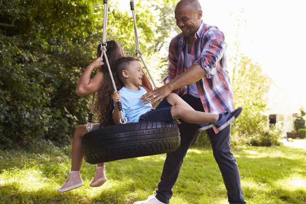 Father and Children On Tire Swing   - Photo, Image