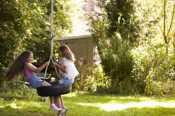 Two Girls Playing On Tire Swing  - Photo, Image