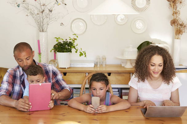 Family using different digital gadgets - Foto, immagini