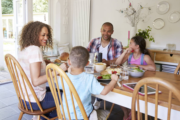 Family at table on kitchen  - Zdjęcie, obraz