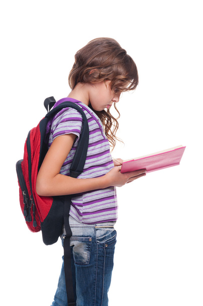 серйозна шкільна дівчина читає книгу
 - Фото, зображення