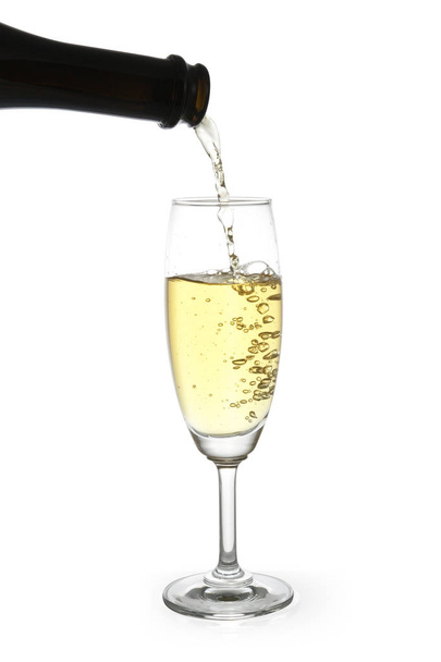 champagne pouring into a glass isolated - Φωτογραφία, εικόνα