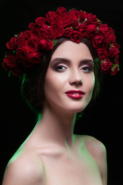 girl with roses on a black background - Photo, image