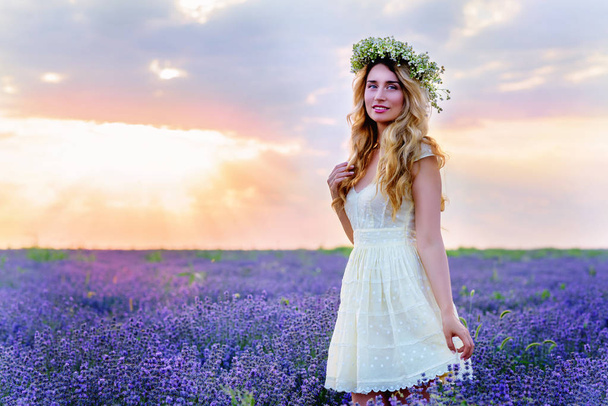 Beautiful Girl in lavender Field at sunset - Фото, зображення