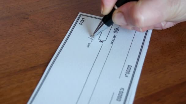 Writing a cheque for payment - Footage, Video