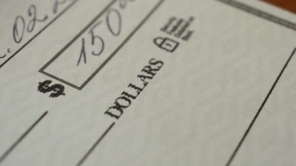 Writing a cheque for payment - Footage, Video