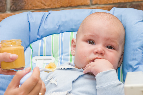 Baby boy while mother feeding - Fotó, kép