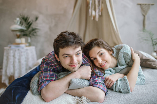 Young hipster couple having fun on handmade bed with dreamcatche - Foto, Bild