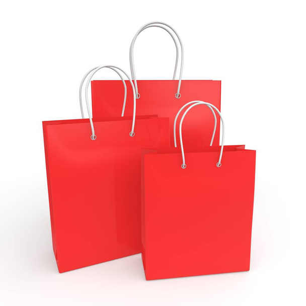 Red empty bags for purchases on a white isolated background - Φωτογραφία, εικόνα