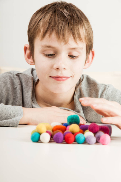Boy playing with gumballs - Photo, Image