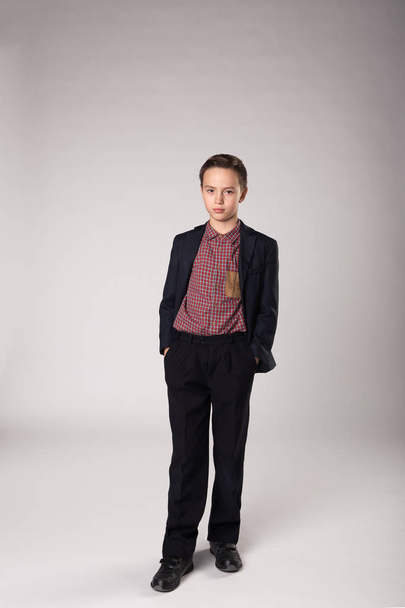 Studio portrait of business child in suit - Φωτογραφία, εικόνα