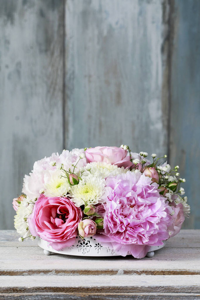 Floral arrangement with pink peonies, tiny roses, chrysanthemums - Foto, imagen