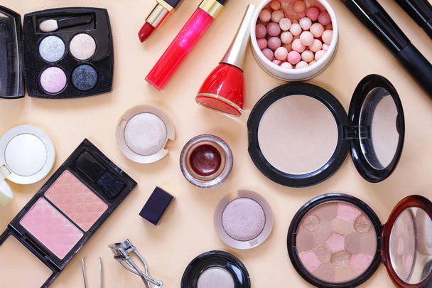Set cosmetics - makeup brushes, eye shadow, powder, lipstick, nail polish - Fotó, kép