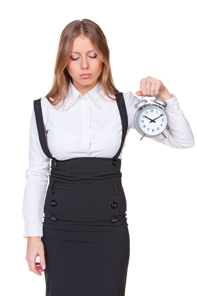 sleepy businesswoman holding alarm clock - Photo, image