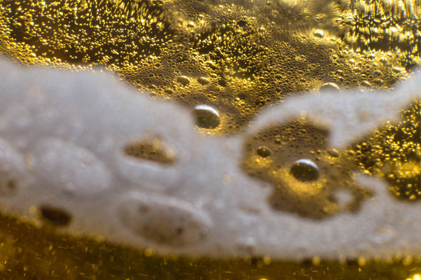 alcohol drink beer on macro picture with sparkles and foam - Фото, зображення