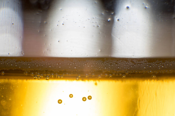 alcohol drink beer on macro picture with sparkles and foam - 写真・画像