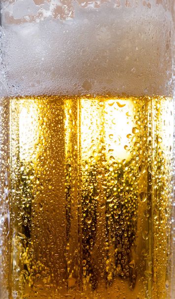 alcohol drink beer on macro picture with sparkles and foam - Фото, изображение