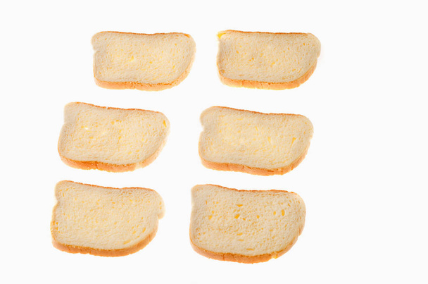 cut pieces of white bread on a white background - Photo, Image