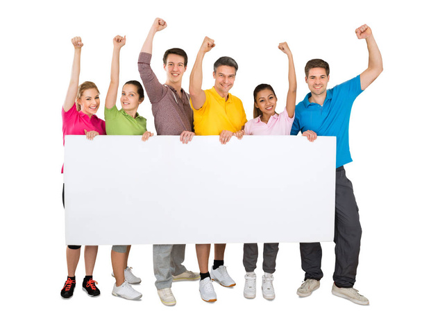 A Successful People Cheering While Holding A Blank Banner In Front Of White Background - Foto, afbeelding