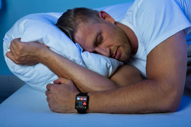 Man Sleeping With Smart Watch - Фото, изображение