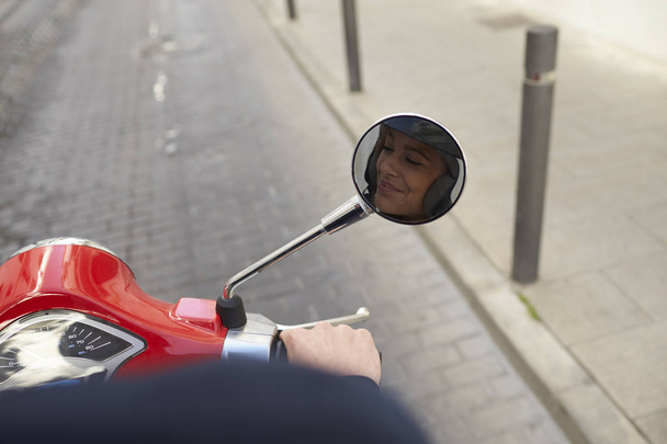 woman riding motor scooter - Fotoğraf, Görsel