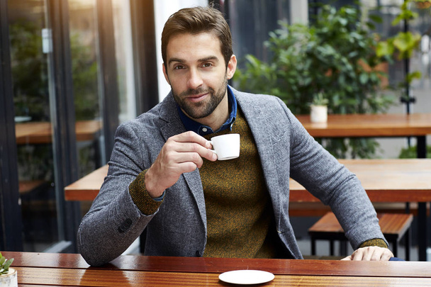 Man smiling over coffee - Fotoğraf, Görsel