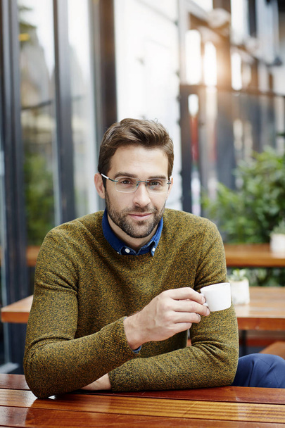 Man in eyeglasses holding coffee cup - Fotoğraf, Görsel