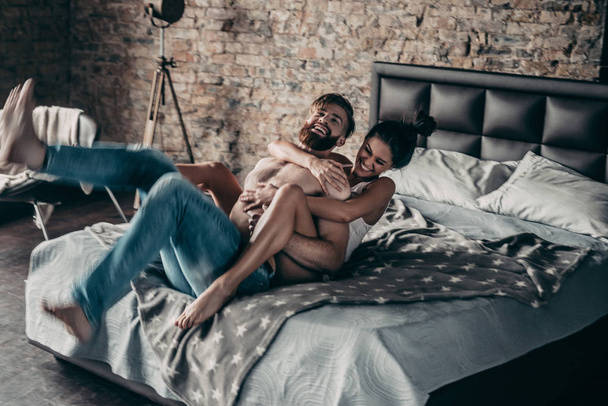 Happy couple in bedroom - Photo, Image