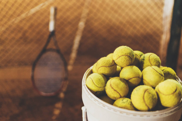 Tennis balls at hopper - Фото, изображение