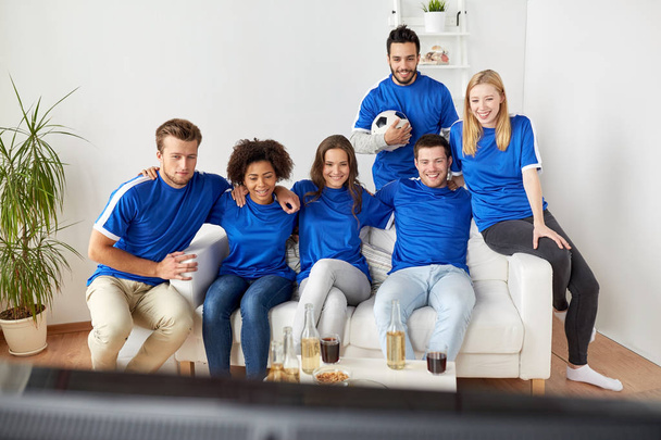friends or football fans watching soccer at home - Foto, Imagen